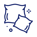 Simple line drawing of two overlapping pillows with a few small decorative dots and sparkles around them, on a light background.